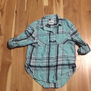 Teal, black and white flannel shirt.